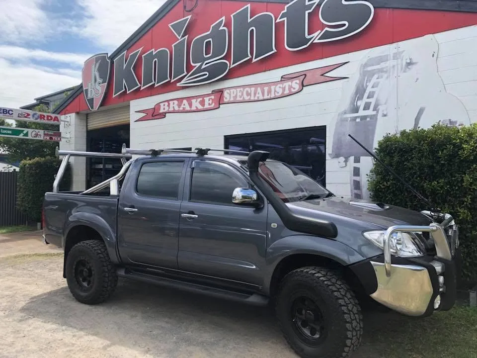 Toyota Hilux 4WD parked outside the Knights Brake Specialists shopfront in Cairns